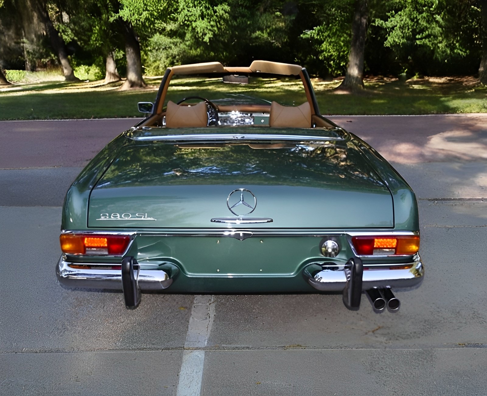 Restored classic German sports roadster 280SL Pagoda showing 97,701 miles closeup perspective